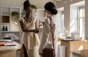 two women shaking hands